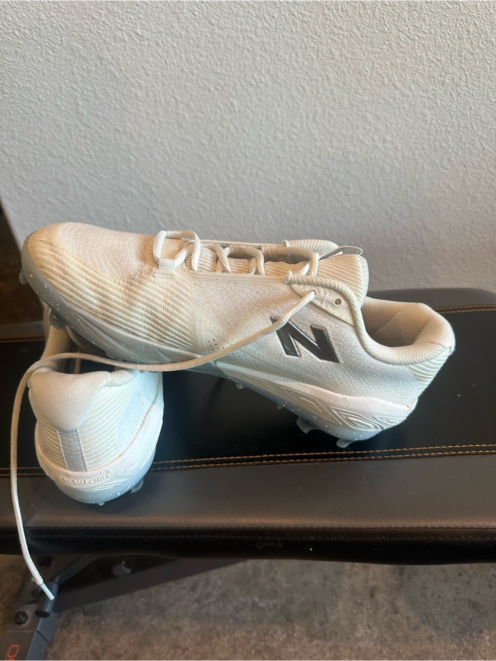New Balance mens White Athletic Cleats